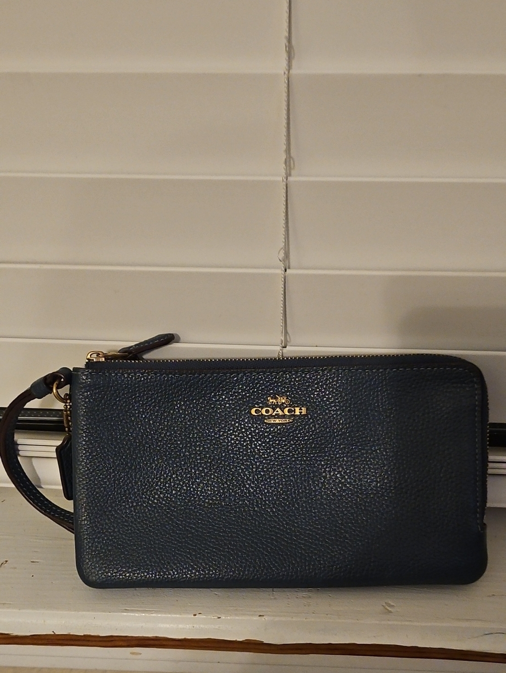 Coach Navy Pebbled Leather Wristlet with Gold Logo